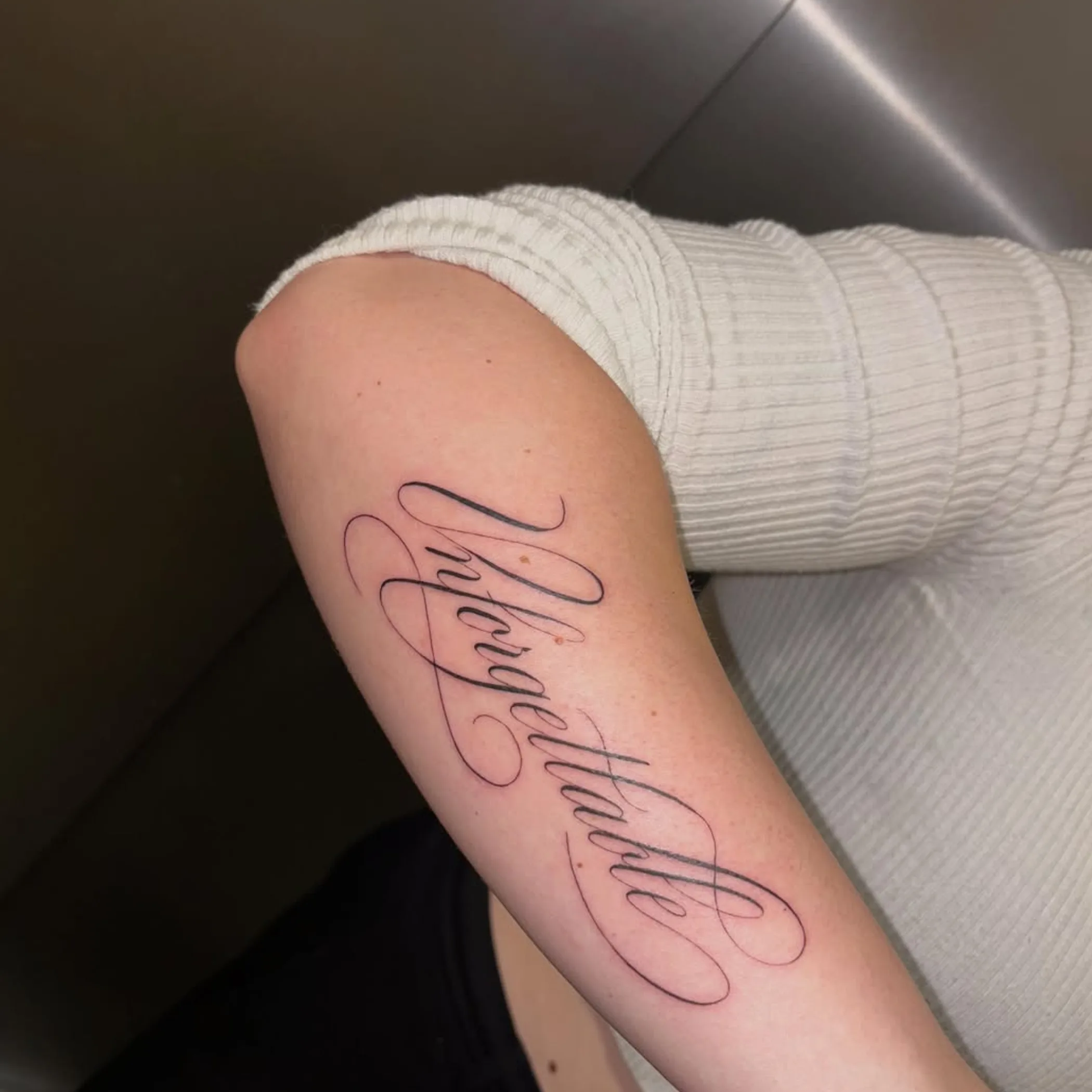 tattoo on forearm skin close-up