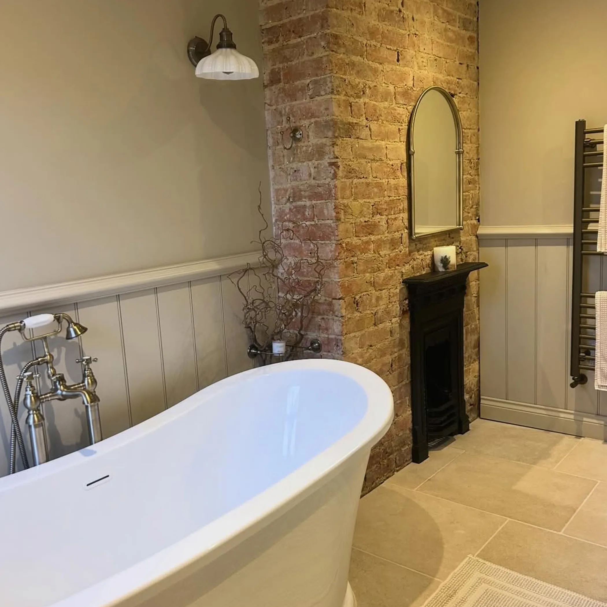 renovated bathroom with vintage plumbing fixtures