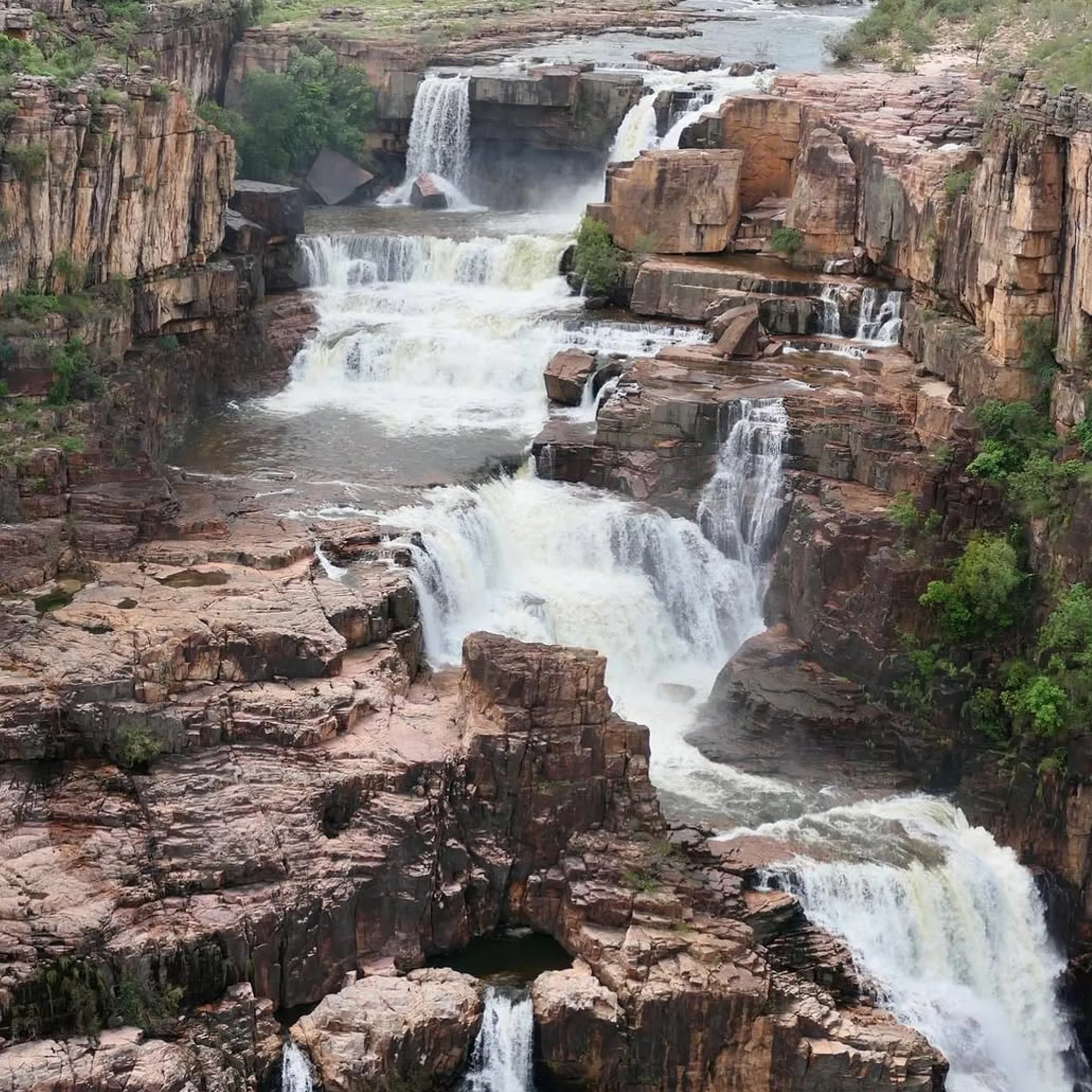 twin falls cascading through rocky gorge
